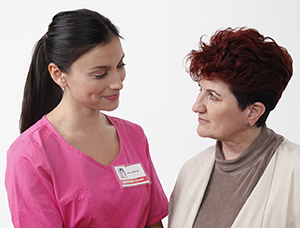 Woman talking to healthcare provider.